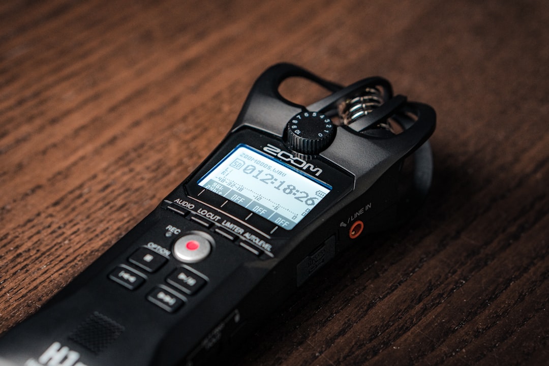 Person testing voice recorder product review