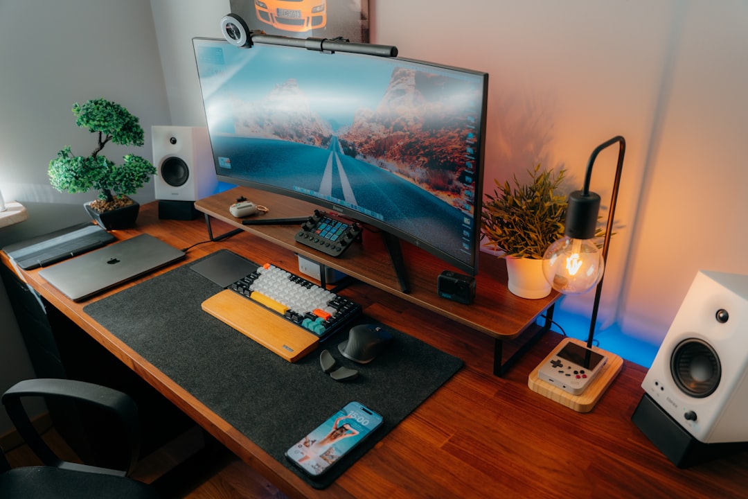 A clean modern desk with organized cable management and minimal visible clutter
