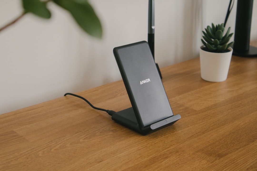 Wireless charging stand with smartphone docked