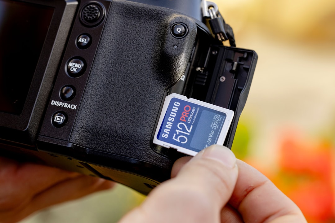 SD card being inserted into card reader slot