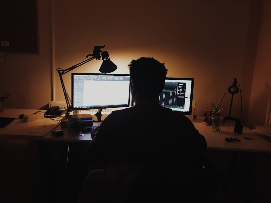 Working late at a computer with screen glow