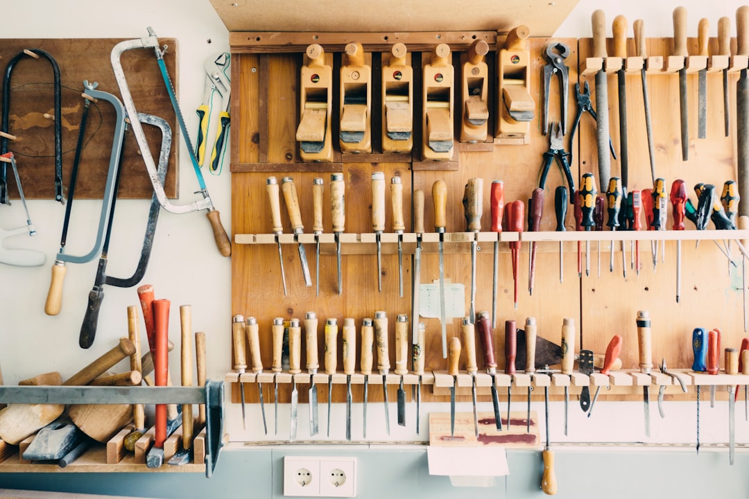 A maker workbench wall covered with organized hand tools
