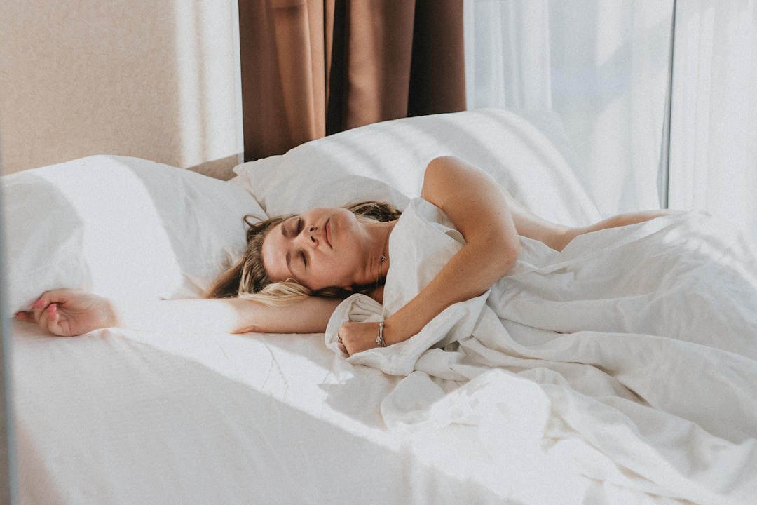 Person sleeping peacefully in bed