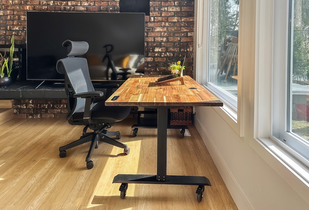 Anti-fatigue mat on floor beside standing desk