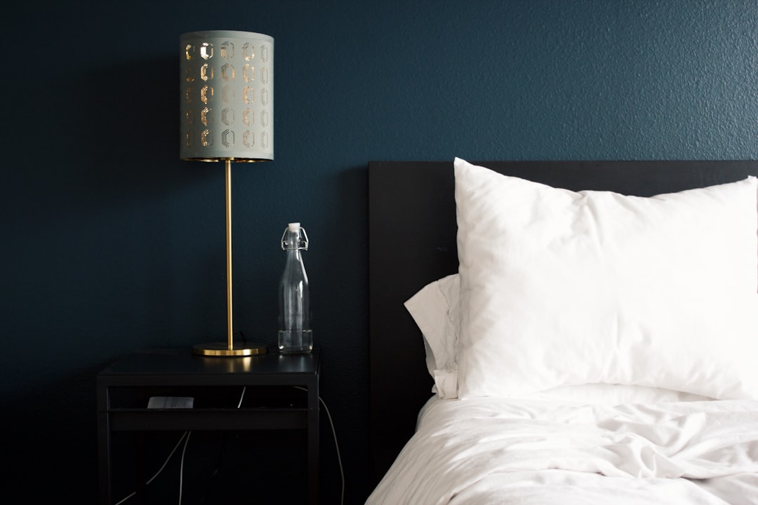 White noise machine on a bedroom nightstand at night