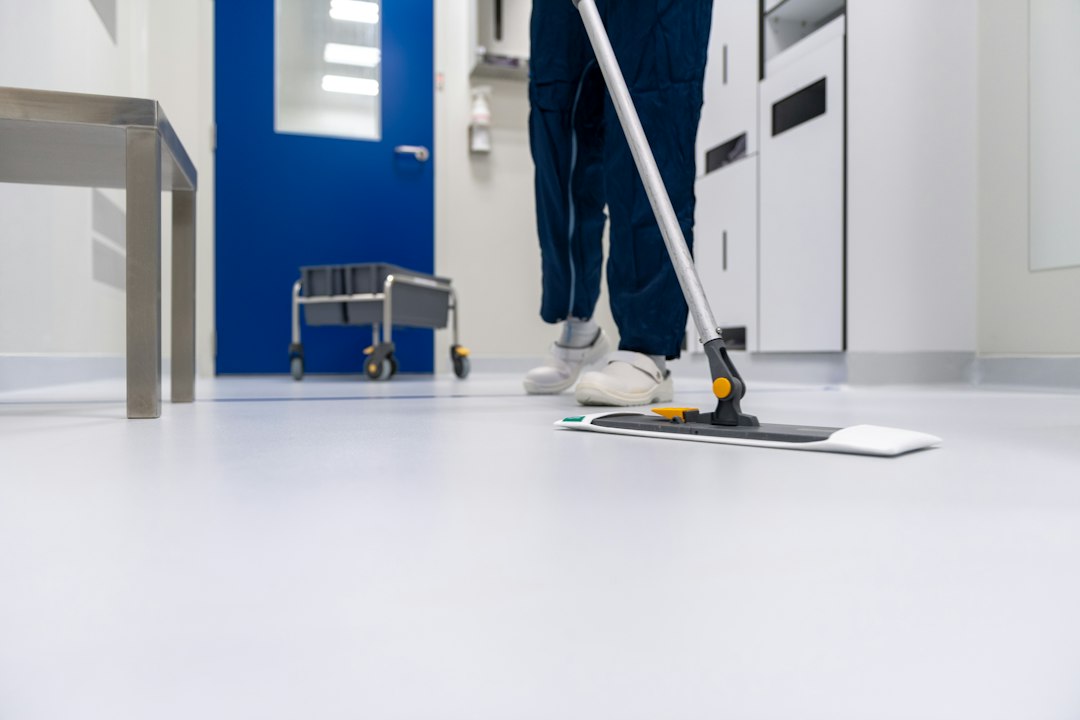 Mopping up water from a floor after a leak
