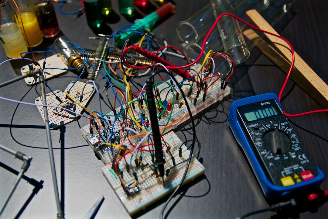 Electronics workbench with breadboards, jumper wires and a multimeter