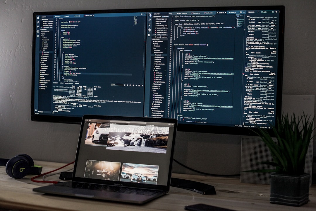 A multi-monitor work setup with a laptop