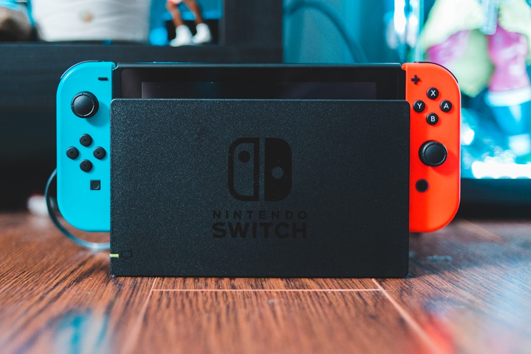 Nintendo Switch console resting beside its dock