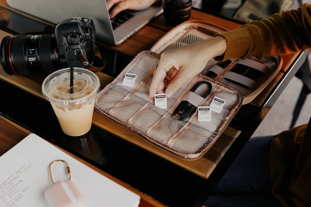 Hand selecting a memory card from an organized accessory case