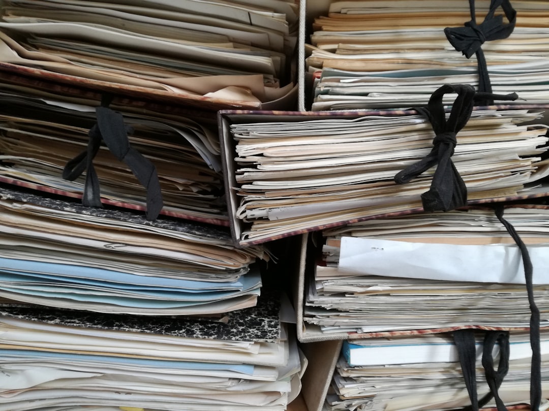 Archive boxes overflowing with decades of documents