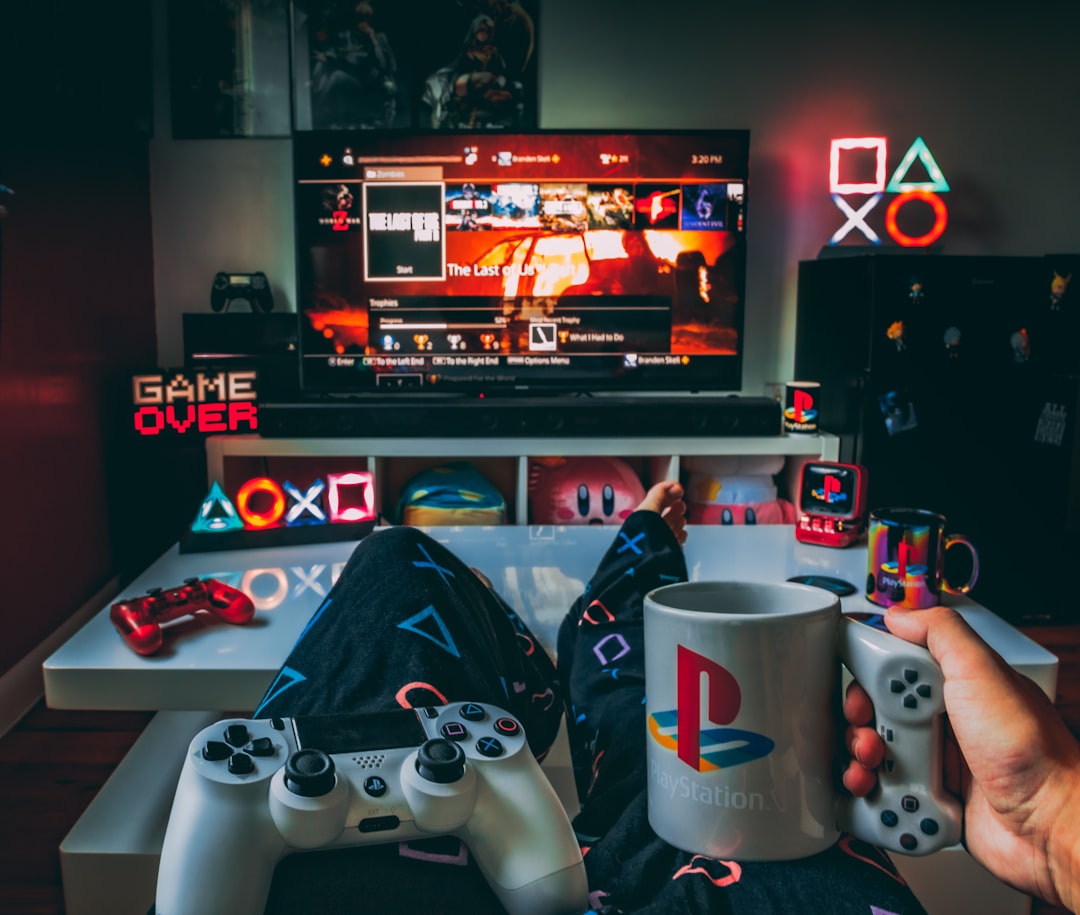 Gaming controllers on a couch in a dim room