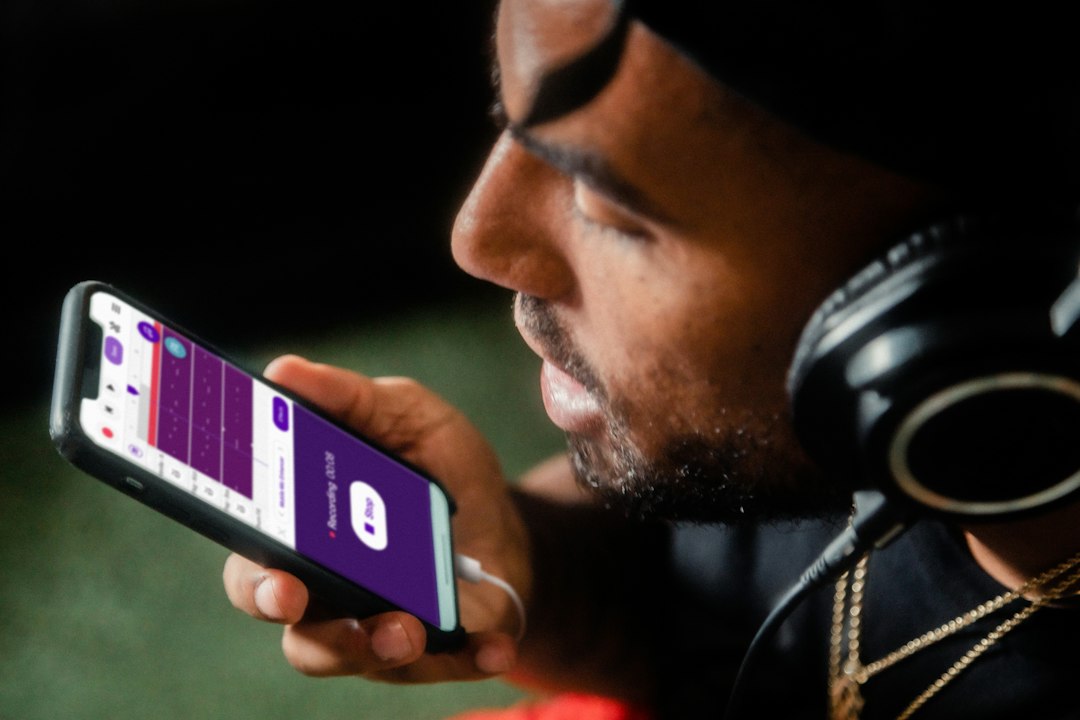 Person recording a voice memo on a phone