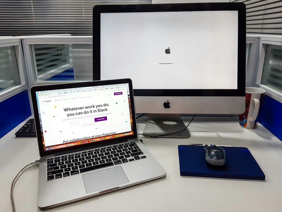 Desk with two computers and two monitors