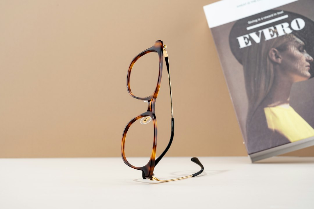 Brown tortoiseshell eyeglasses standing on a table