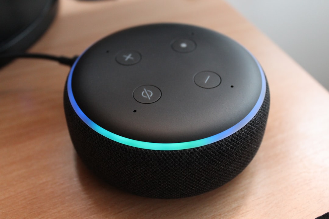 Smart speaker with glowing light ring on a wooden table