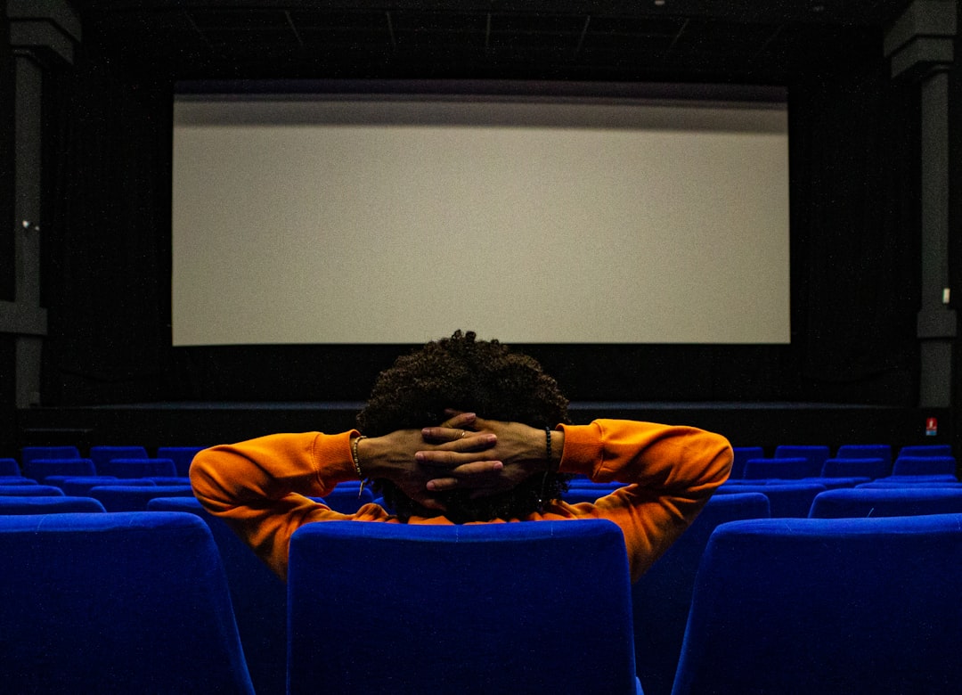 Movie theater audience watching the big screen