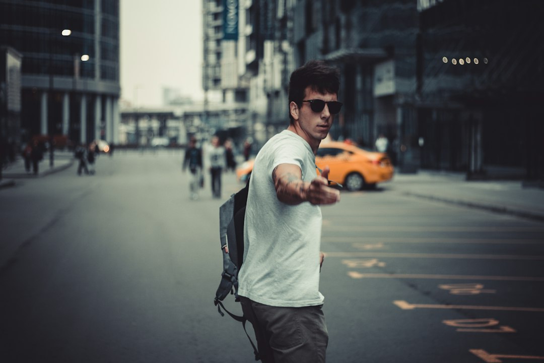 Man wearing sunglasses on a city street