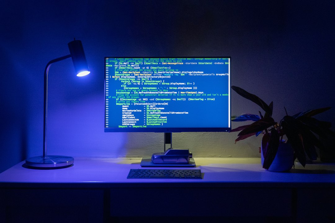 A monitor displaying a dark-themed terminal code editor