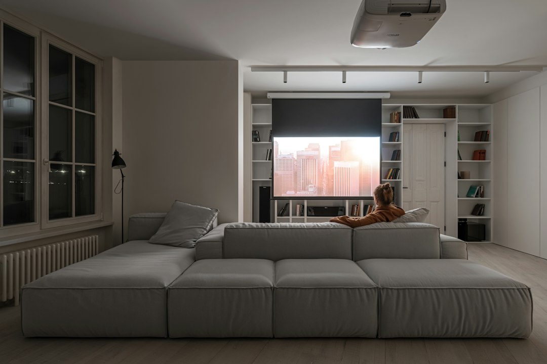 A movie projected in a darkened living room