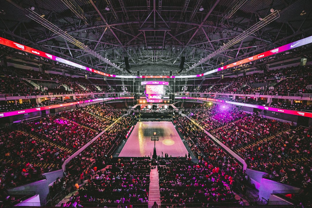 Basketball game arena crowd watching courtside action
