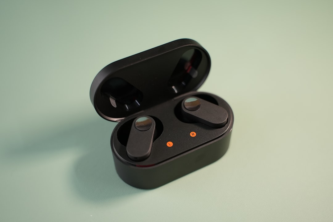 Wireless earbuds docked in an open charging case