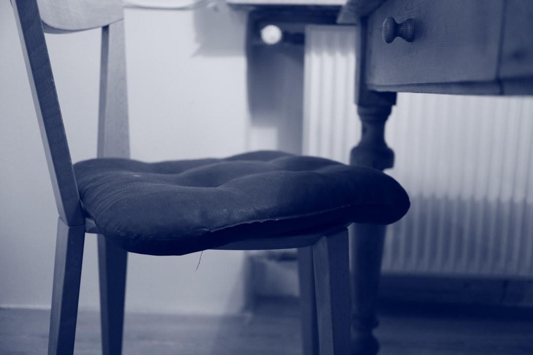 Cushioned seat pad improving an existing chair