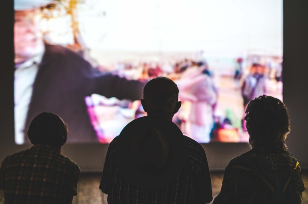 Friends watching a projected movie together