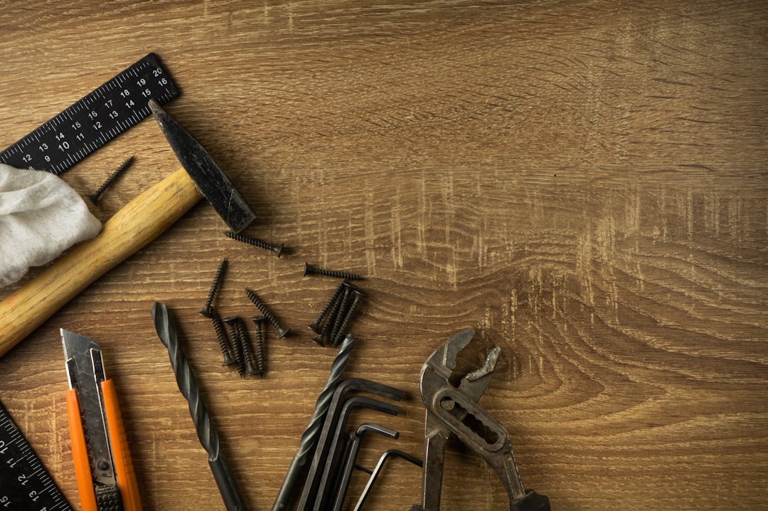 Hex keys and mounting hardware laid out on a wooden table
