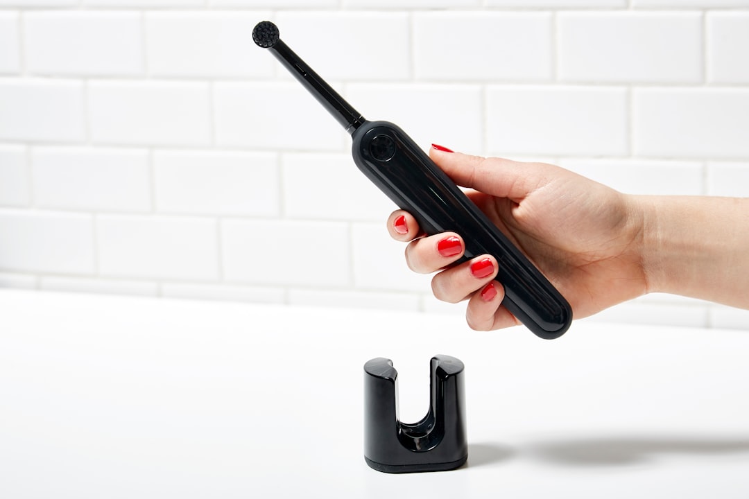 Handheld oral care device with its charger
