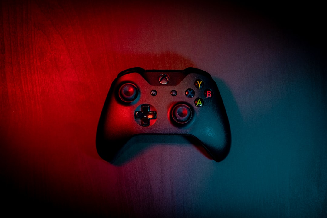 Close-up of a game controller's analog stick and buttons