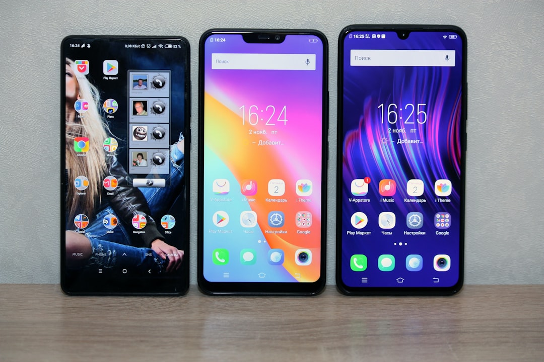 Three smartphones lined up on display