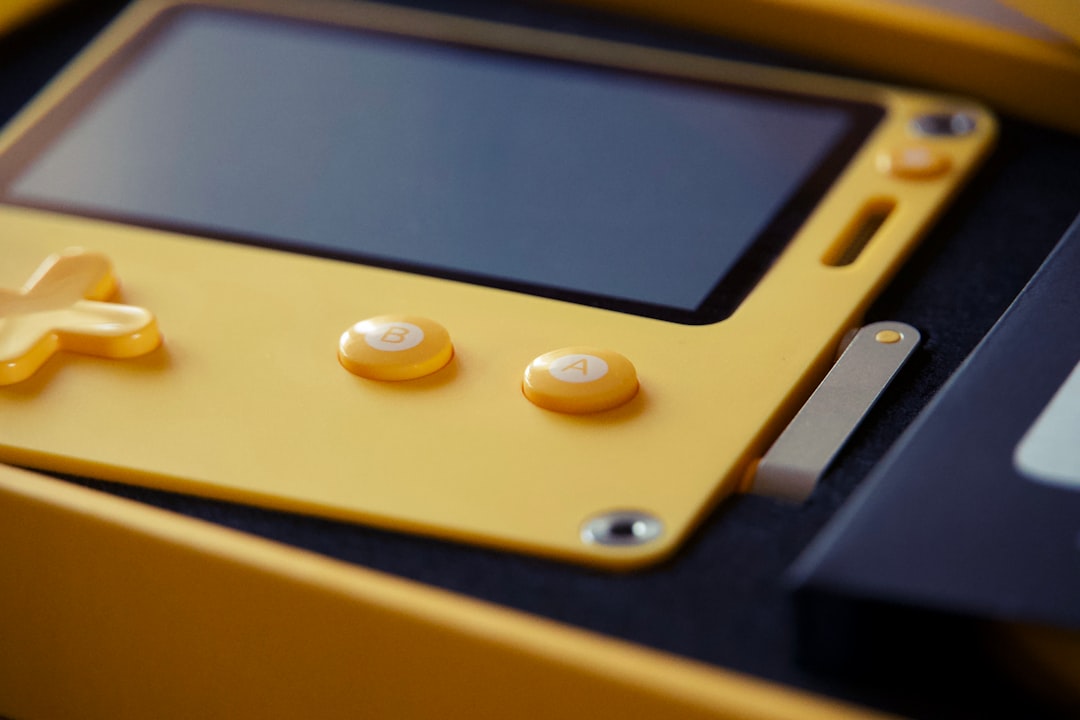 Retro handheld gaming device with colorful buttons