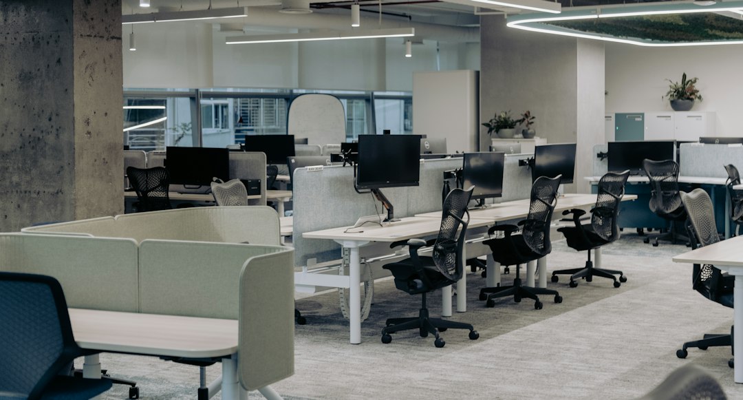Office desks with multiple computer monitors