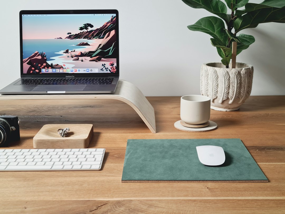 Clean minimal desk setup with laptop on a riser