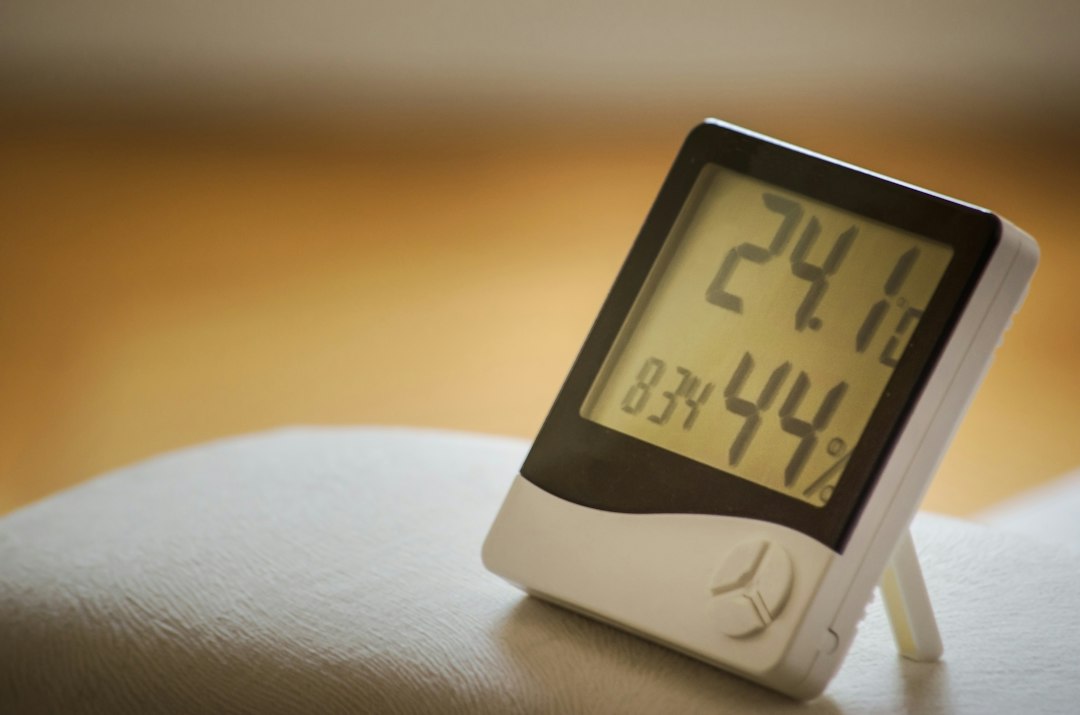 Compact digital weather console showing temperature and humidity