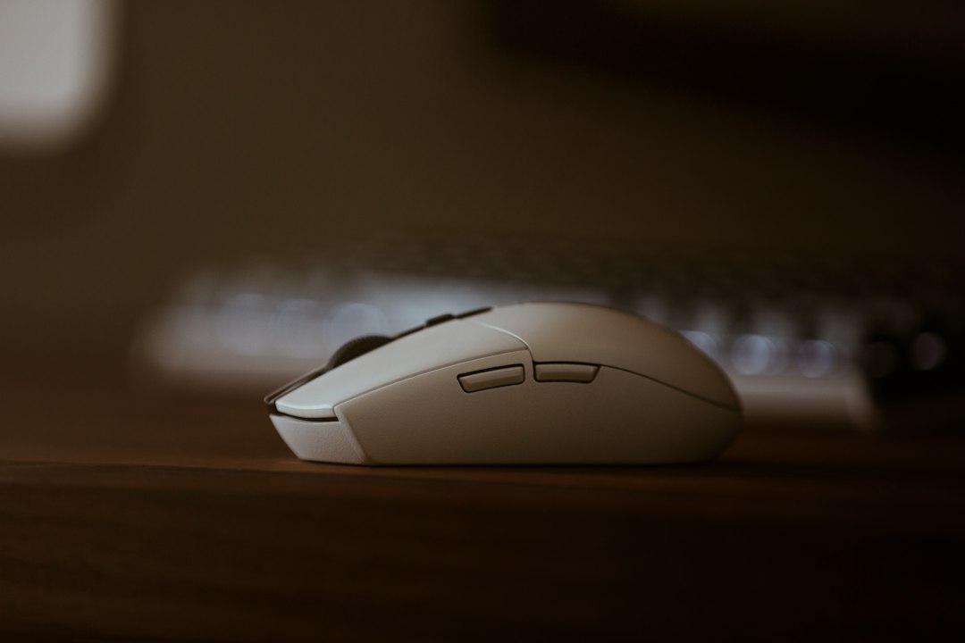 Wireless mouse on wooden desk