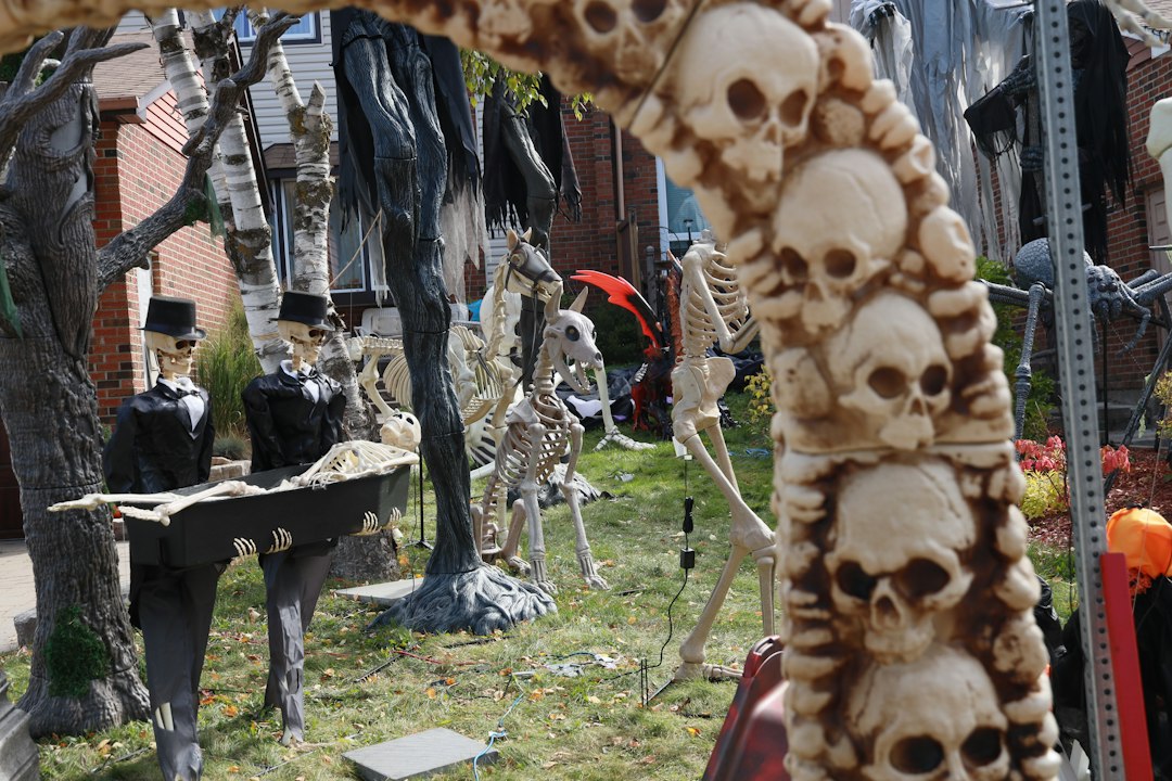 Yard decorated with skeletons, skulls, and gravestones