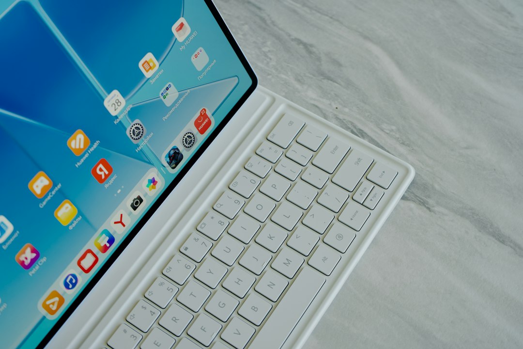 A tablet attached to a keyboard case on a desk