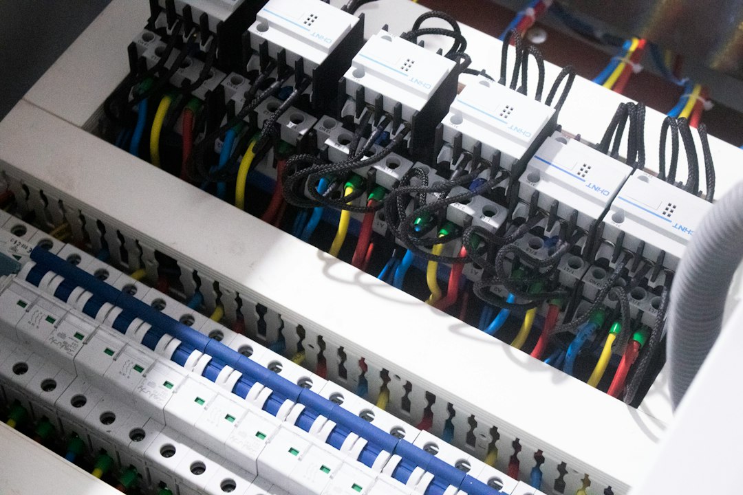 An open electrical panel, which is where an overloaded office circuit announces itself. You do not need to open yours to read the number on the breaker handle.