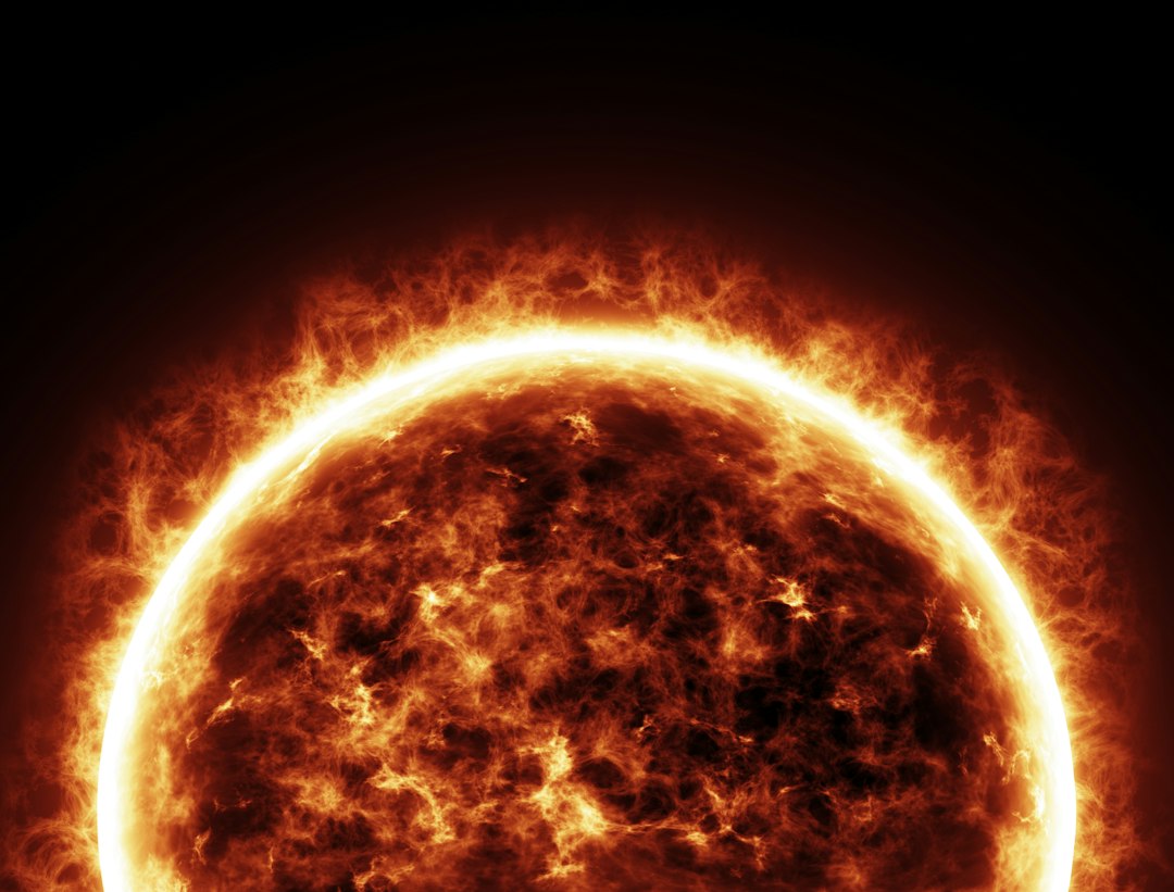 Close-up of the sun's surface showing granulation and sunspots