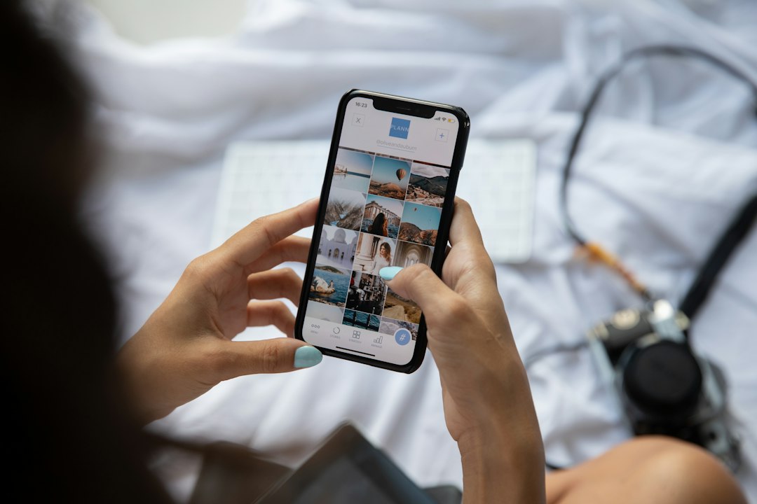 Hands scrolling through a photo gallery on a smartphone