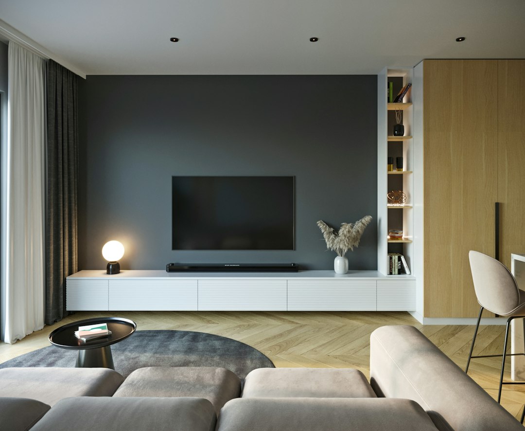 A wall-mounted television and soundbar in a modern living room