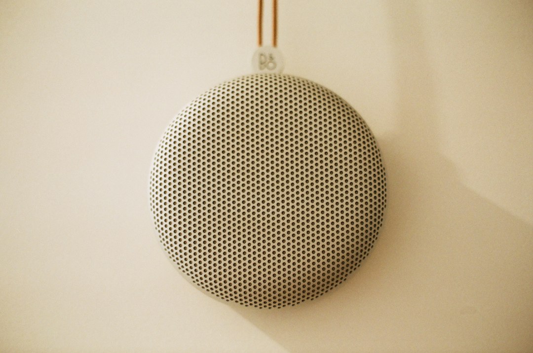 A smart speaker sitting on a shelf