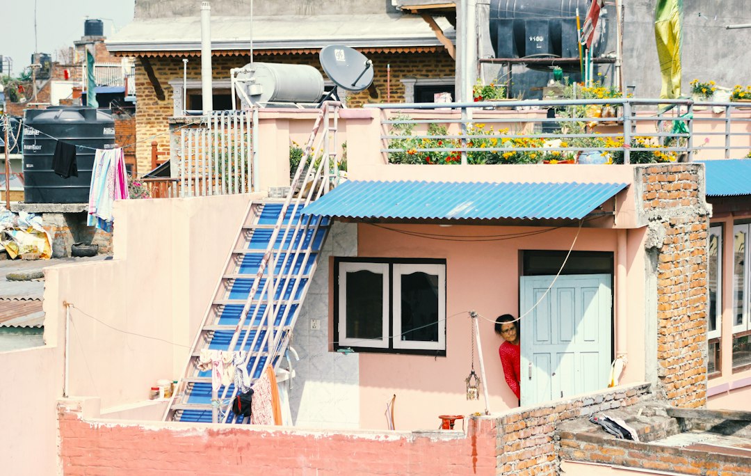 Ladder resting against a rooftop during daytime work