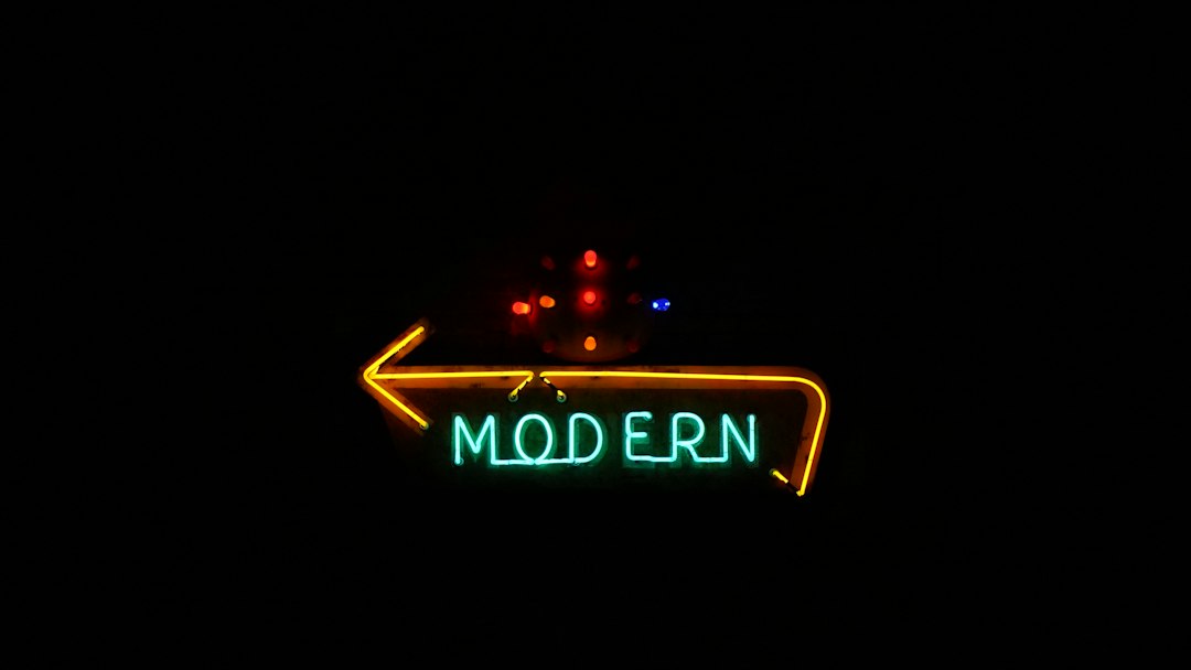 A neon sign reading MODERN against a dark background