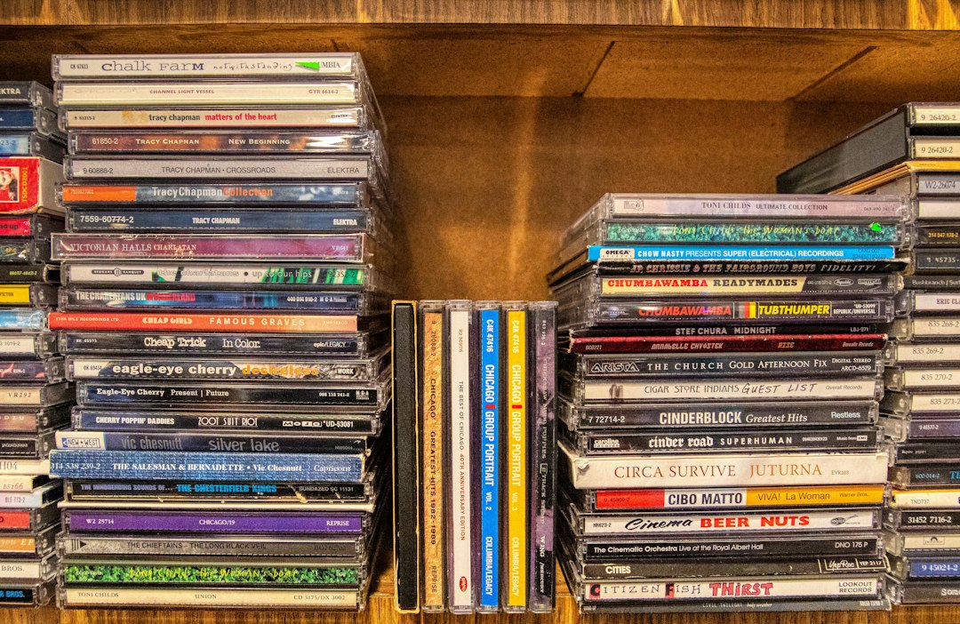 Shelves stacked with rows of CDs in a home collection