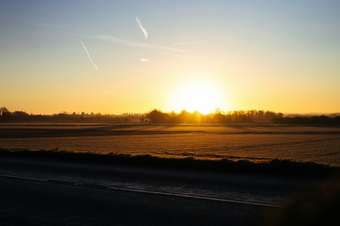 Golden sunrise over frosty fields