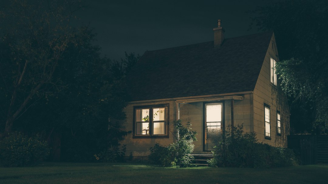House at night with interior lights glowing