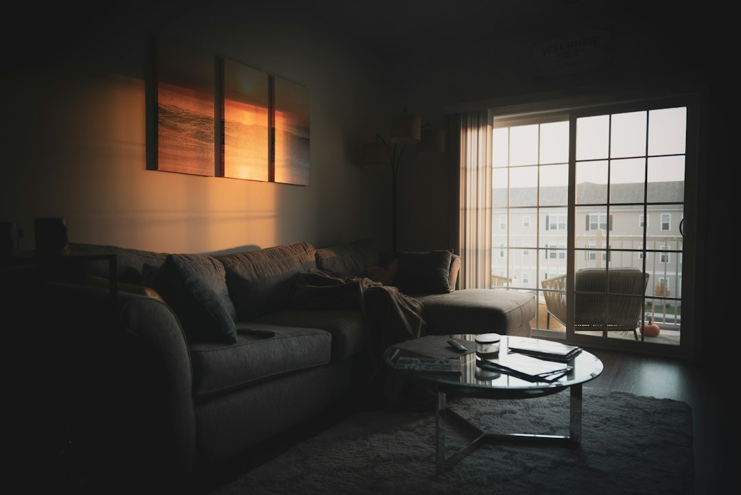 A dim living room lit by warm evening light